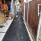 Disperkim Kabupaten Sukabumi laksanakan pengaspalan jalan lingkungan di Kampung Selajambe untuk mendukung akses dan aktivitas ekonomi warga.